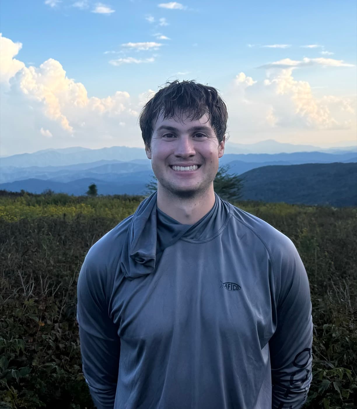 John, Trailstack's founder, on a mountain overlook at sunset